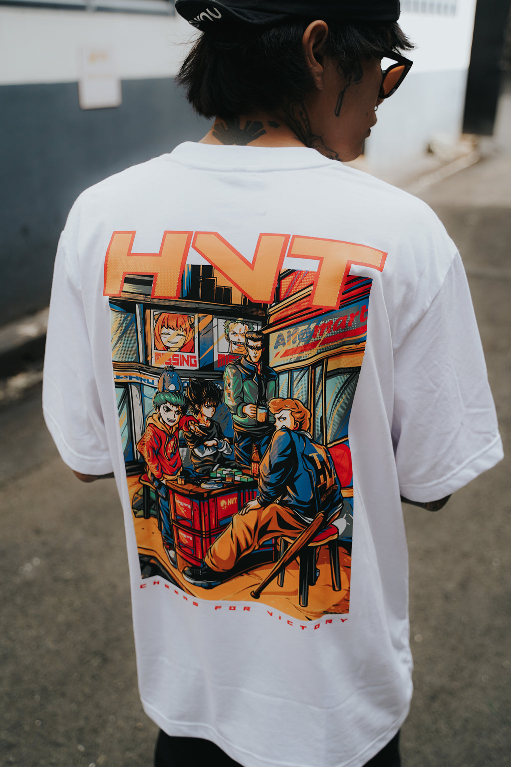 Graphic tee with detailed group illustration and bold streetwear anime concept