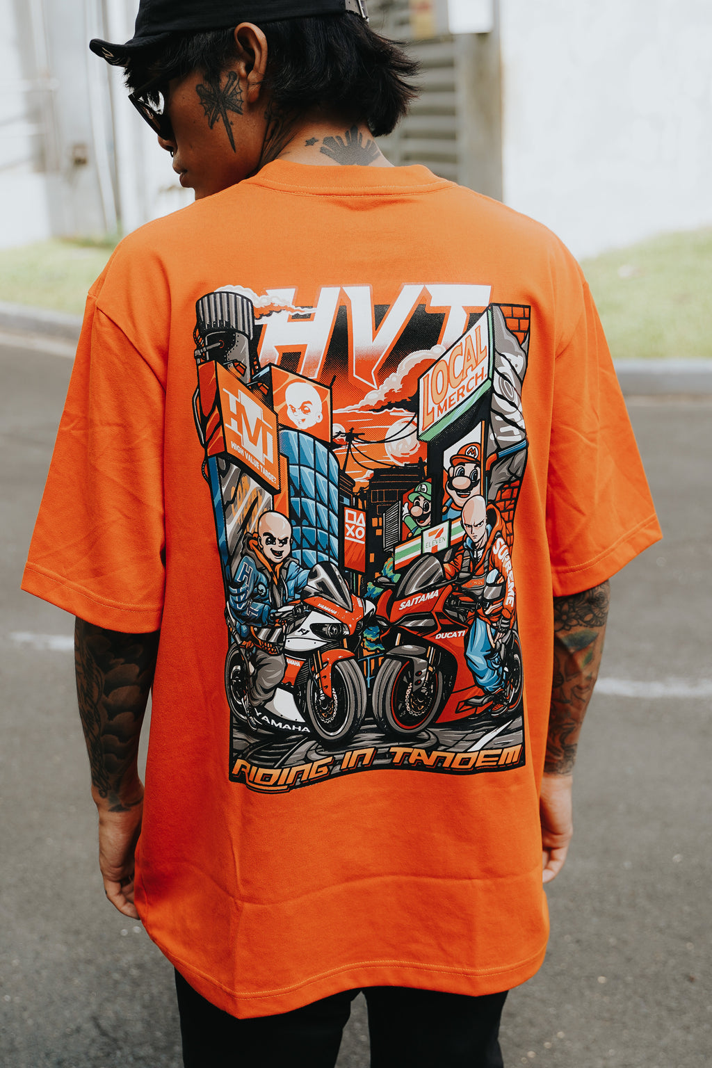 Graphic T shirt with animated riders and motorcycle theme for urban outfit styling