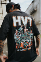 Oversized black tee with illustrated anime crew sitting around money stacks, detailed urban fashion back print