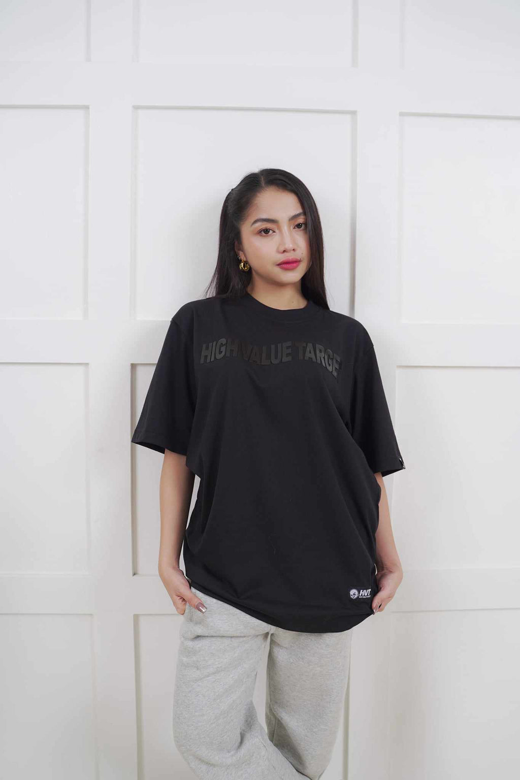 Black graphic T shirt with subtle lettering for modern and clean outfit combinations
