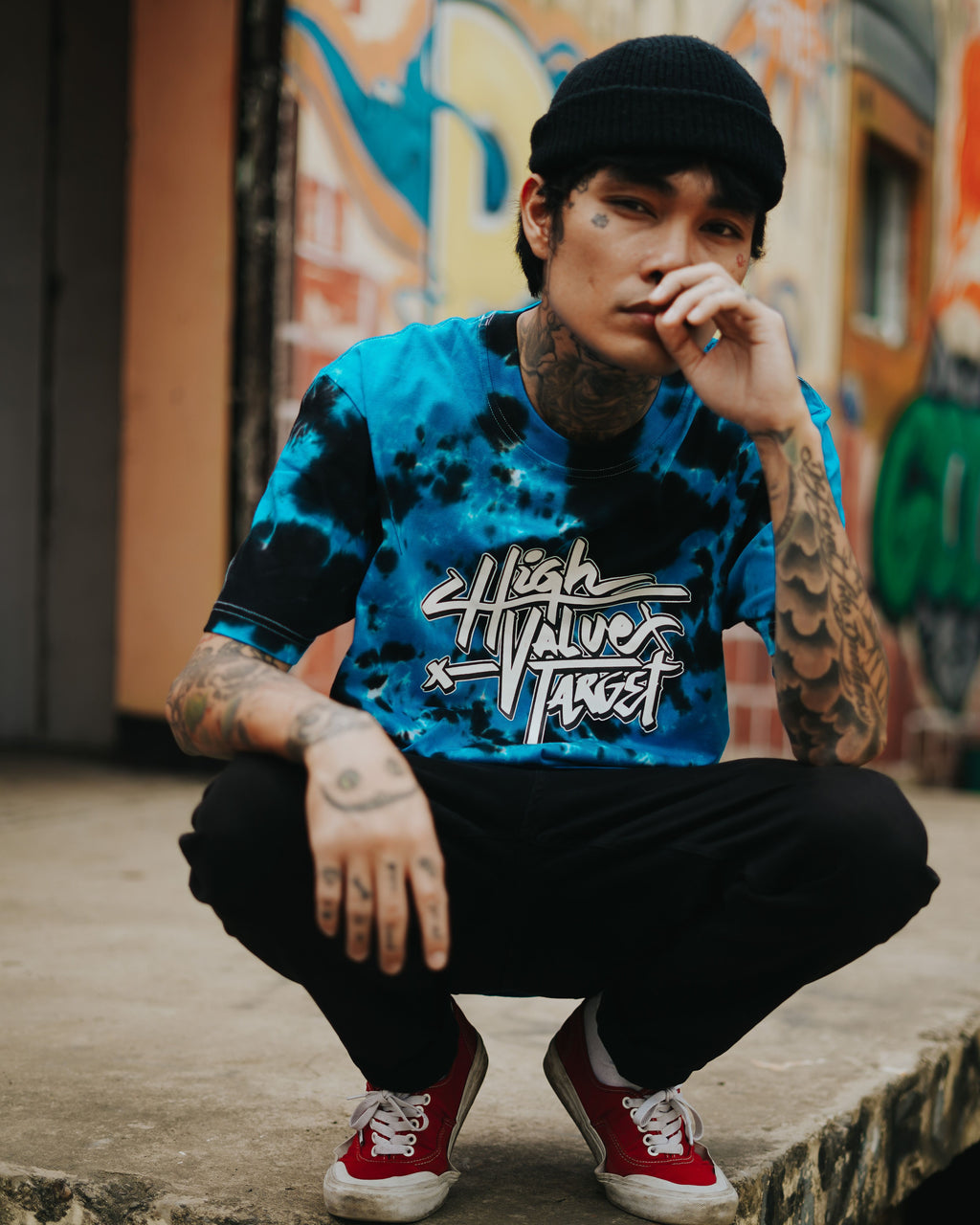 Blue tie dye T shirt with vibrant color pattern for casual everyday streetwear style