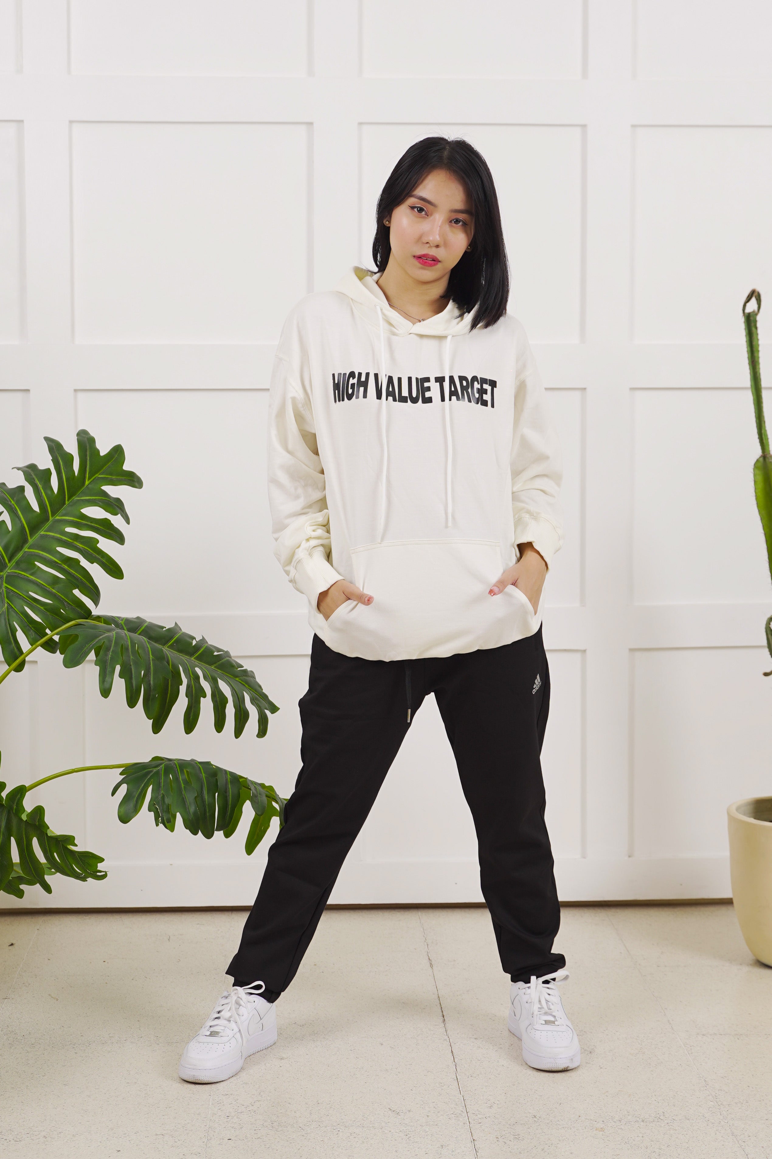 Modern streetwear hoodie with HVT logo on chest, minimal typography design for clean urban fashion outfit