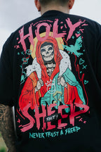 Streetwear shirt with skeleton and sheep illustration, dark humor concept with never trust the sheep front graphic