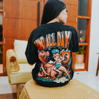 Graphic tee with dinosaur rider character and cash bag illustration with bold slogan
