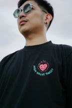 Graphic tee featuring flaming heart artwork with High Value Target lettering, modern streetwear style front print