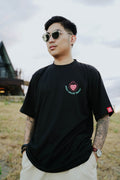 Black streetwear t-shirt with burning heart graphic and High Value Target text on front, bold edgy fashion design