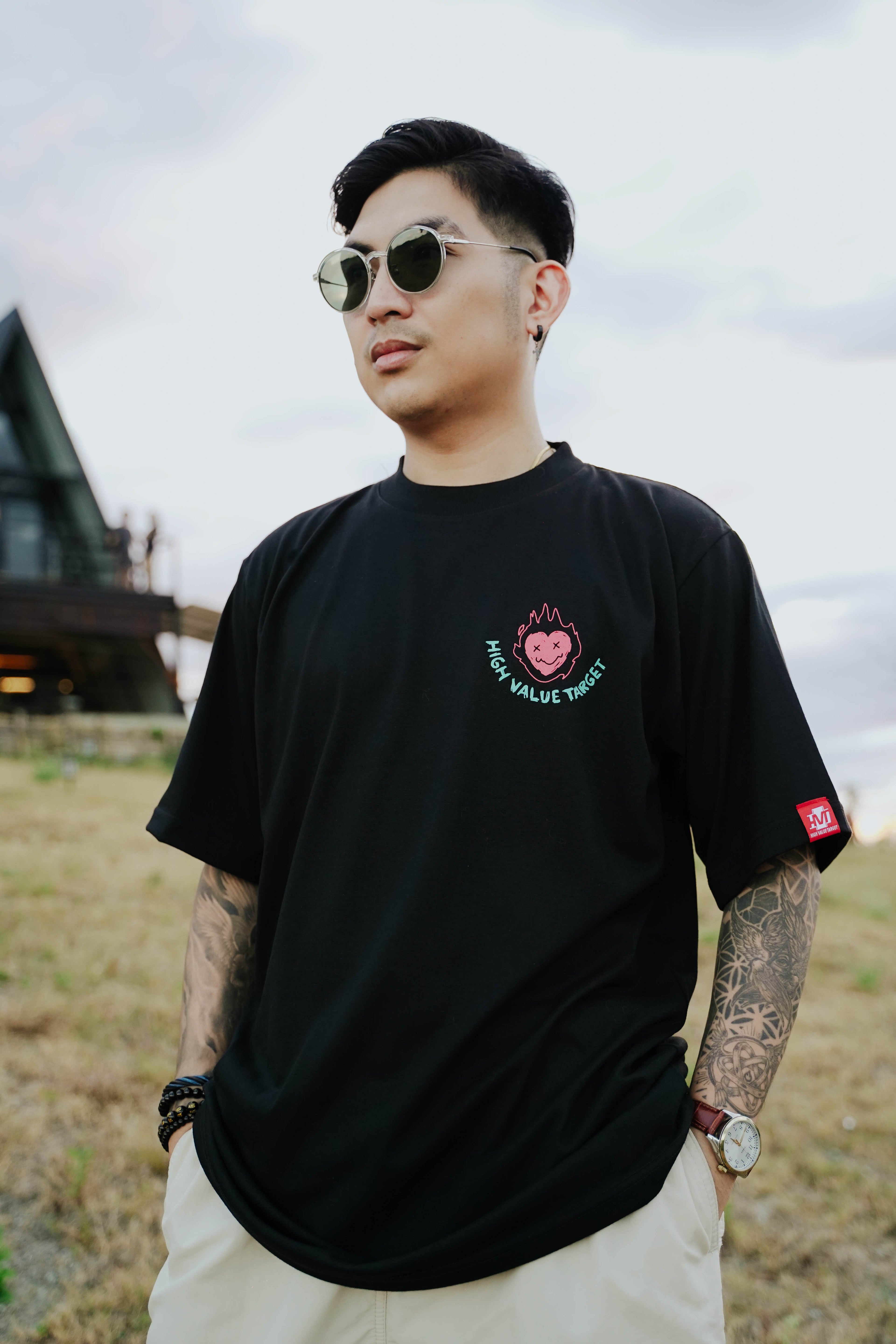 Black streetwear t-shirt with burning heart graphic and High Value Target text on front, bold edgy fashion design