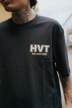 Black graphic shirt with HVT lettering on front chest, clean high value target logo design in modern streetwear style