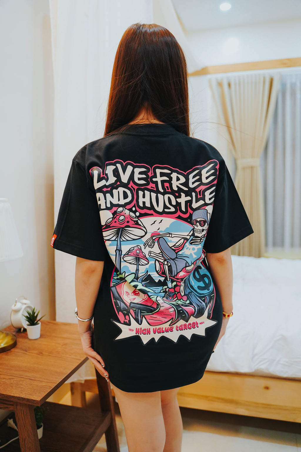 Graphic tee with detailed skeleton lounging scene and creative streetwear concept