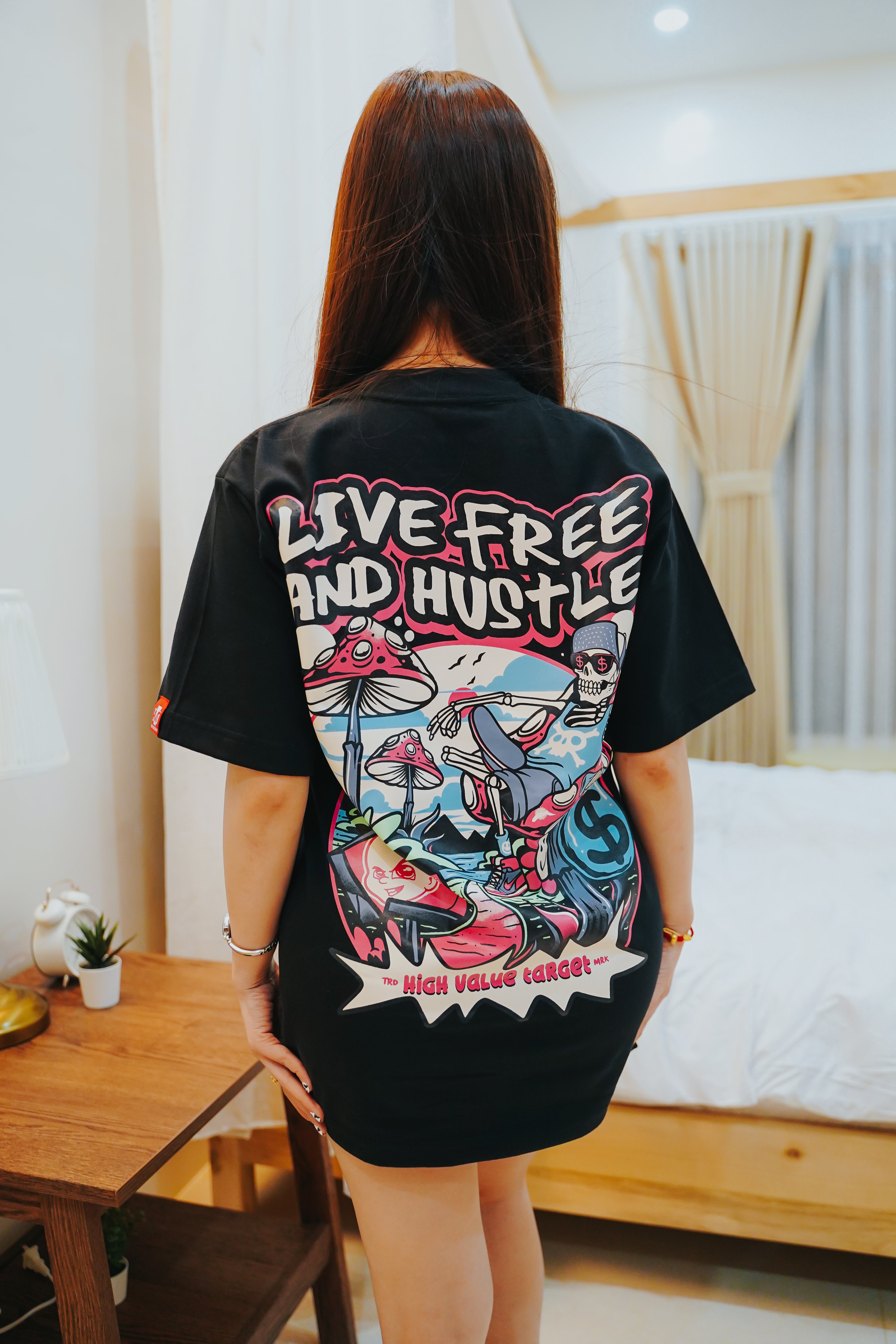 Graphic tee with detailed skeleton lounging scene and creative streetwear concept