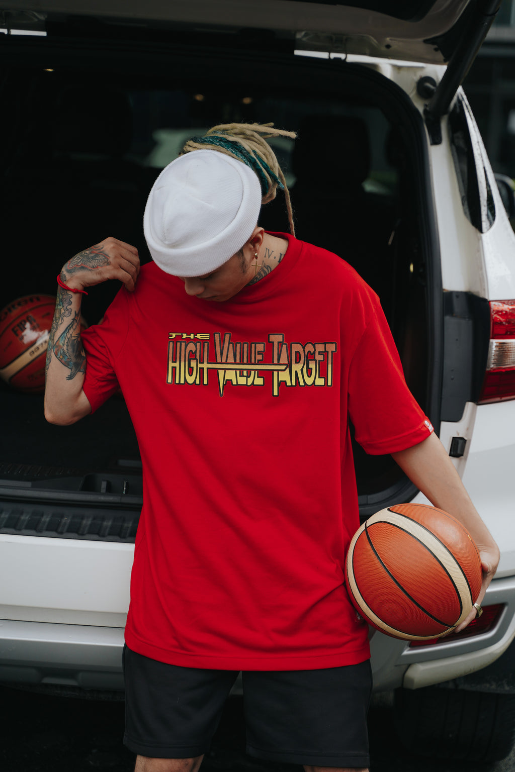 Red streetwear shirt with strong typography and hustle inspired Rise and Grind message
