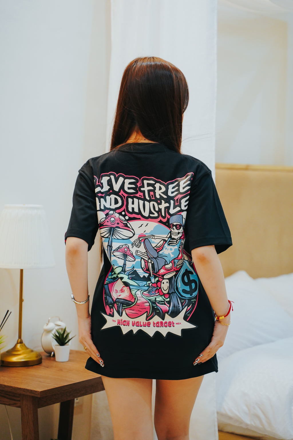 Live Free and Hustle T shirt with skeleton character and bold streetwear design