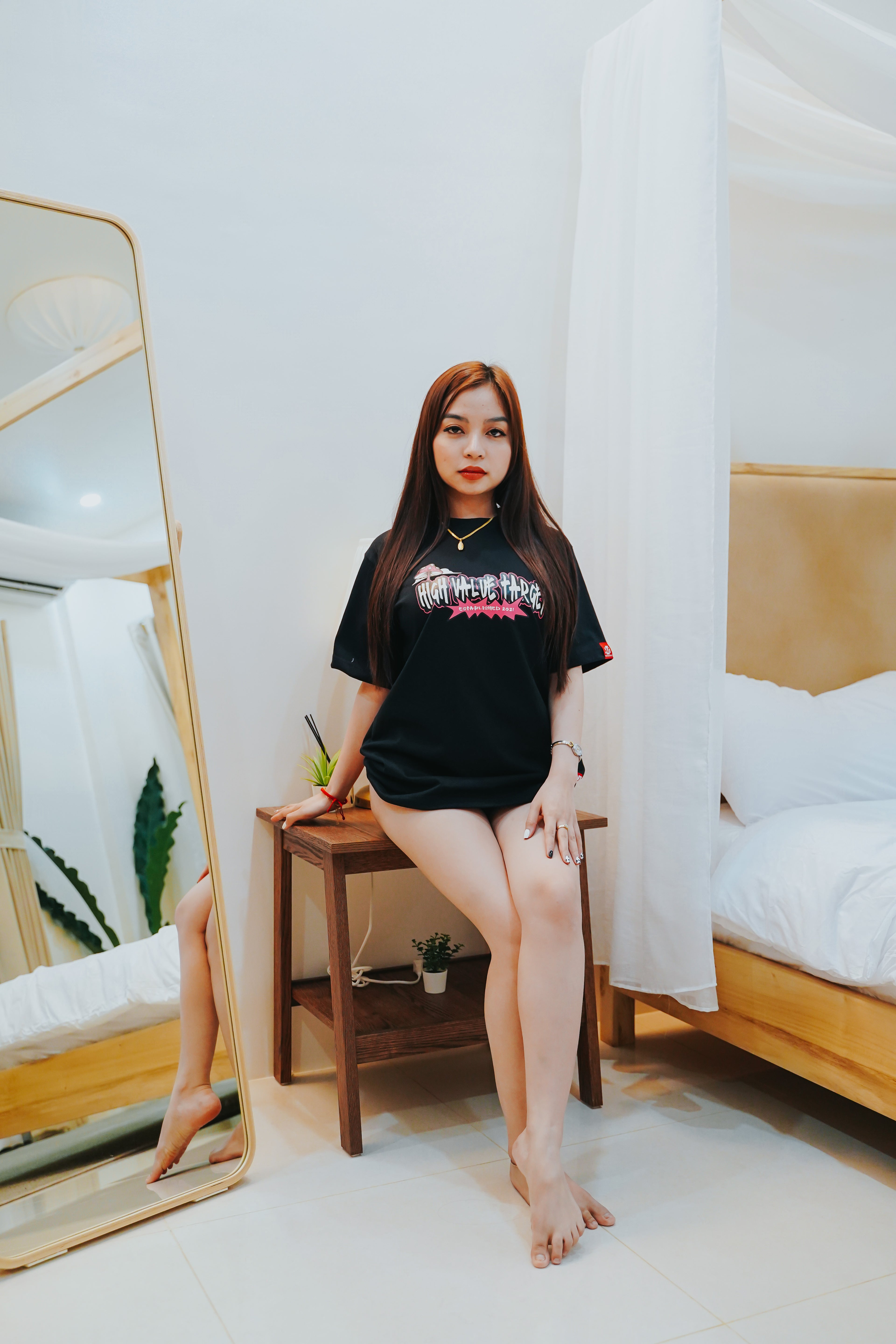 Streetwear T shirt with bold graffiti text and minimal accent graphic layout