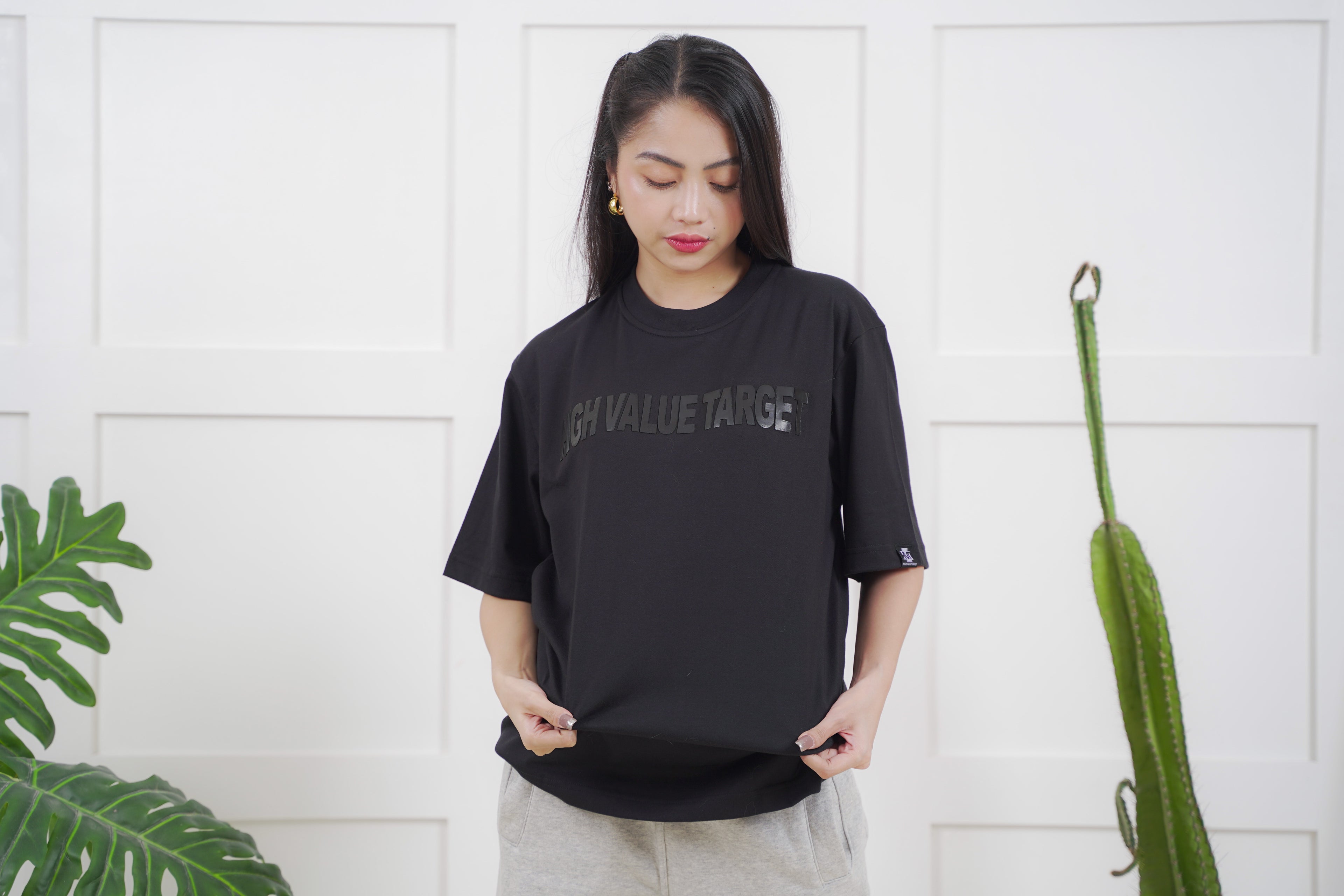 Streetwear tee with tonal text design and low contrast graphic layout