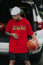 Red streetwear T shirt with Rise and Grind theme and bold typography for everyday outfit style
