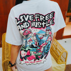 Black graphic tee showing relaxed skeleton with cash and mushrooms, Live Free and Hustle slogan in bold design