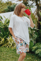 Vacation themed mesh shorts with all over icon print, breathable fabric and relaxed fit for summer streetwear style