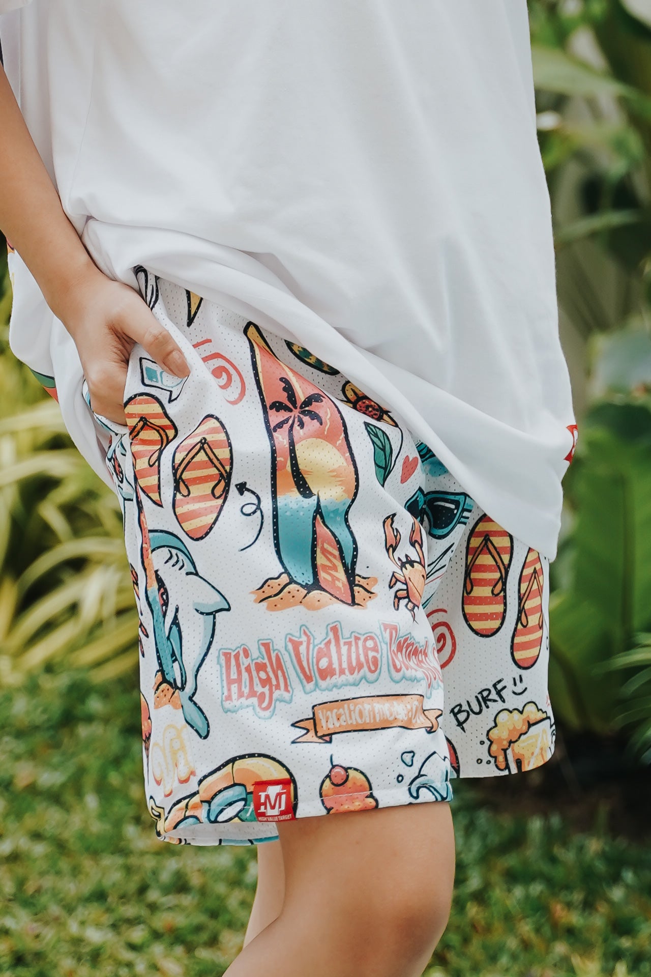 Modern mesh shorts with Vacation Mode On design and assorted getaway icons, comfortable summer fashion piece